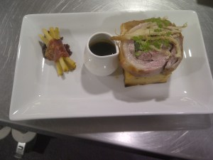 Stuffed lamb loin, rosemary and parmesan pommes anna, beetroot glaze