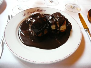 Profiteroles with chocolate sauce, ice cream filling