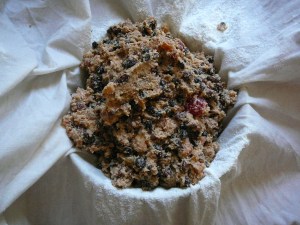 Laying the cloth over a bowl to give shape to the mix
