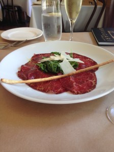 Beef carpaccio and prosecco