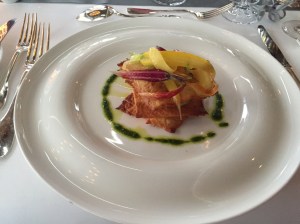 Mille-feuille of crispy potatoes, vegetable puree flavoured with truffles and crispy chips