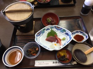 Lunch , tea, hoto noodles(in pot), mussels, sashimiof tuna and lake prawns, pickles, braised lotus root