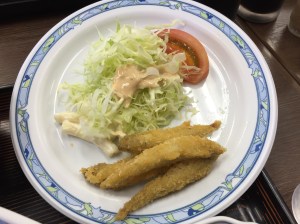 Crumbed fish and salad