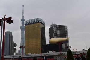 About to pass under Asakusabashi looking to Asahi Tower and Tokyo Skytree
